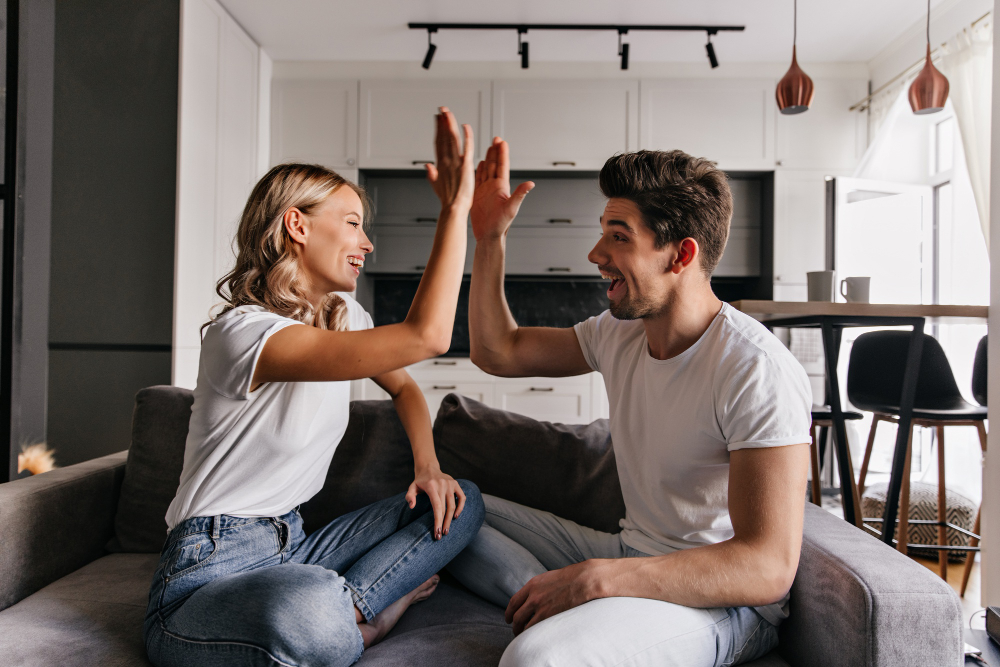 stylish-blonde-girl-playing-with-boyfriend-living-room-indoor-portrait-joking-young-people